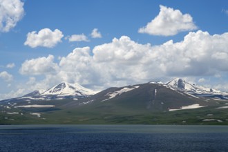 Majestic snow-capped mountains above a deep blue lake, Lake Parawani, Samtskhe—Javakheti Highlands,