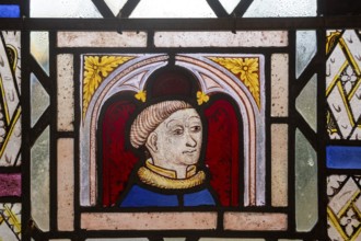 Close-up of medieval style male figure possibly a monk, Ufford church, Suffolk, England, UK
