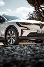 Close-up of a parked white car with modern wheels and clean design, Deer e-Carsharing, Renault
