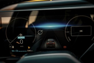 Modern cockpit display of an electric car with blue light effects, Deer E-Carsharing, Renault