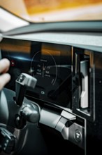 Close-up of car interior with futuristic display and control, Deer e-car sharing, Renault Megane,