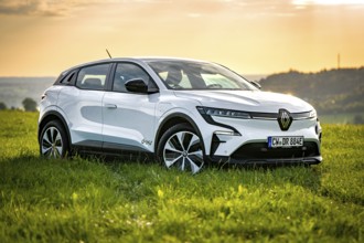 White car parked in a meadow during sunset, Deer E-Carsharing, Renault Megane, Calw, Germany