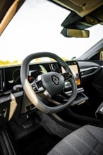 Interior view of a car with modern steering wheel and clear dashboard, Deer E-Carsharing, Renault