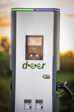 Charging station for electric cars in natural surroundings at sunset, Deer E-Carsharing, Renault