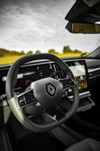 Modern car interior with detailed steering wheel and large display, Deer e-Carsharing, Renault
