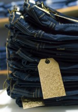 Close up of blue jeans on others with copy space, Various jeans on others with space for text,