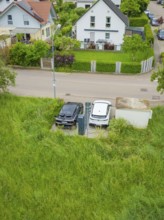 Aerial view of electric cars at a charging station in a residential area, Deer E-Carsharing, Calw,