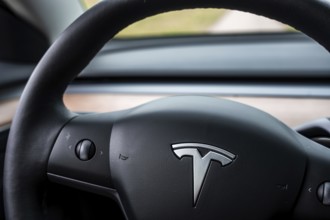 View of a Tesla steering wheel in a minimalistic car interior, Deer e-Carsharing, Tesla Model 3,