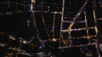 A Drone night view of Aleppo, Syria on December 19, 2025, showing illuminated streets, dense