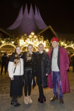 Reiner Schöne with woman Anja Schöne and children Charlotte-Sophie and Olivia at the premiere of
