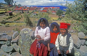 Children wearing traditional clothes on Isla Taquile in Lake Titicaca, Andean Highlands, Peru,