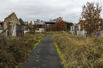 Dilapidated halls of the dilapidated plant of a former agricultural production cooperative of the