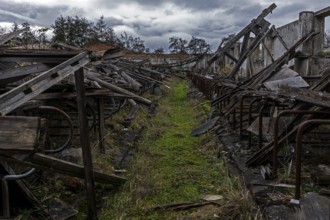 Dilapidated hall of the dilapidated plant of a former agricultural production cooperative of the