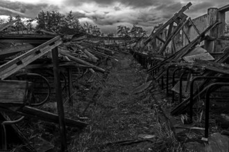 Dilapidated hall of the dilapidated plant of a former agricultural production cooperative of the