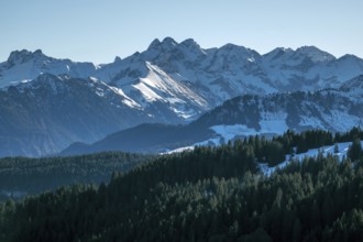 View from the high-altitude hiking trail from Bolsterlanger Horn to Riedberger Horn, snow-capped