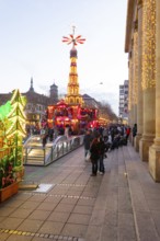 Stuttgart 2025 Christmas market on Schlossplatz with festive lights, a Christmas pyramid, mulled