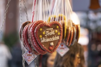 Colourful gingerbread hearts hang on the festive stands at the Stuttgart Christmas market. They are