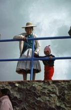 Traditionally dressed young woman with infant, Puno, Andean Highlands, Peru, South America,