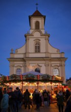 Carousel, catholic church of the Most Holy Trinity, people, visitors, baroque Christmas market,
