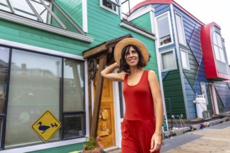 Happy tourist walking through fisherman's wharf park, enjoying a sunny summer day among vibrant,