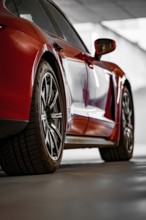 Close-up of a red car in a garage, sporty wheels, shadow games, Porsche Taycan, Deer car sharing,
