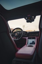 Modern car interior with steering wheel and advanced cockpit, Porsche Taycan, Deer car sharing.