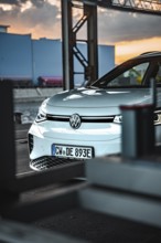 A car is parked in an industrial area at dusk, VW ID4 electric car, Deer Carsharing, Calw, Germany