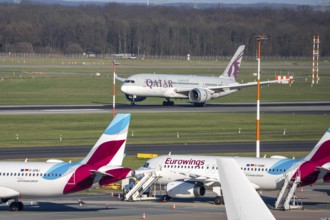 Düsseldorf airport, Qatar Airways Boeing 787 Dreamliner landing, Eurowings aircraft on the apron,