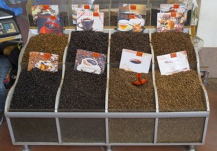 Market stand with various types of coffee beans and corresponding prices, Akhaltsikhe market,