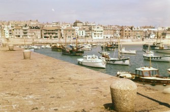 Boats at moorings in the harbour at St Ives, Cornwall, England, UK c 1960