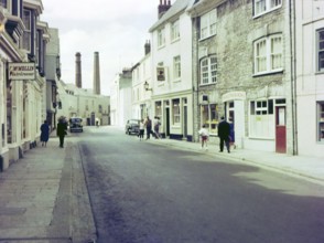 NB Poor focus, Historic Southside Street, Maritime Inn pub view to chimneys of gin distillery,
