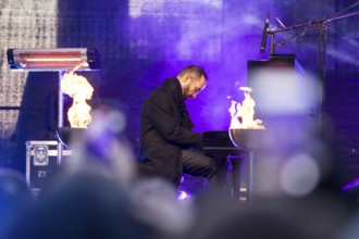 Igor Levit (pianist) plays the piano at the lighting of the 20th anniversary Hanukkah in front of