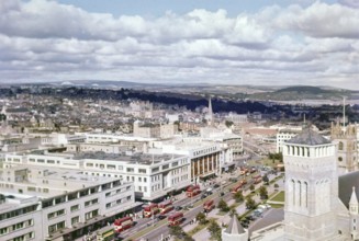 View over Royal Parade city centre street with red double decker buses, Plymouth, Devon, England,