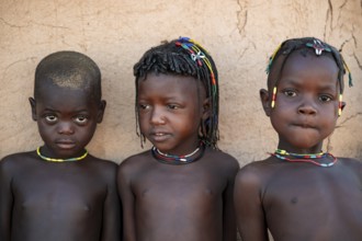Three children in the village, the Hakaona tribe also Havakona or Hakawona, near Opuwo, Kunene,