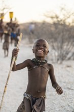 Happy Himba child laughing, traditional Himba village, Kaokoveld, Kunene, Namibia
