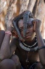 Portrait, cheerful Himba girl, traditional Himba village, Kaokoveld, Kunene, Namibia