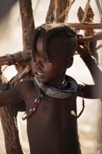 Portrait, young Himba child, traditional Himba village, Kaokoveld, Kunene, Namibia