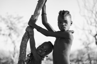 Black and white, portrait, two Himba children, traditional Himba village, Kaokoveld, Kunene,