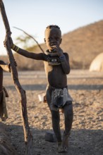 Young Himba child, traditional Himba village, Kaokoveld, Kunene, Namibia