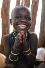 Portrait, laughing Himba child, traditional Himba village, Kaokoveld, Kunene, Namibia