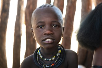 Portrait, curious Himba child, traditional Himba village, Kaokoveld, Kunene, Namibia