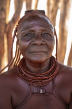 Elderly Himba woman, portrait, traditional Himba village, Kaokoveld, Kunene, Namibia