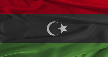 Flag of Libya with fabric textured background. Close up of National flag of Libya with realistic
