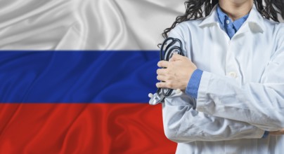 Healthcare professional with Russia flag background. Professional doctor holding stethoscope on