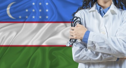 Healthcare professional with Uzbekistan flag background. Professional doctor holding stethoscope on