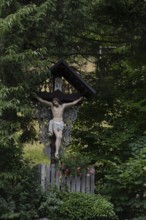 Traditional waycross with figure of Christ, mountaineering village Zgornje Jezersko, Slovenia