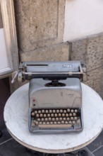 Historic typewriter on a small table, old town of Ljubljana, Slovenia
