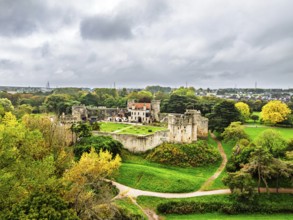 Autumn Colours over ruins of Caldicot Castle from a drone, Caldicot, Monmouthshire, Wales, UK