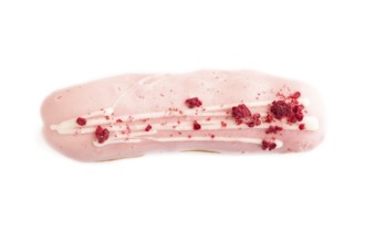 Glazed pink Eclair on brown concrete isolated on white, top view, flat lay, close up