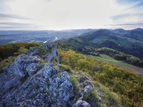 View from the Gisliflue of an autumnal forest with the Jura foothills behind, Talheim, Canton,